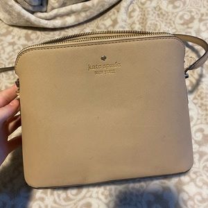 Kate Spade purse, beige. Has some flaws but overall still a good quality purse.